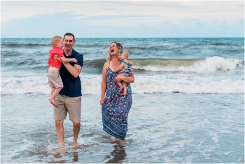 Family in ocean during Family Beach Portraits in Melbourne Beach, Florida