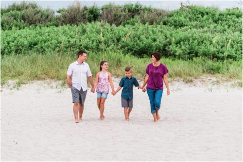 Family walking on beach with serapes Central Florida Family Photography