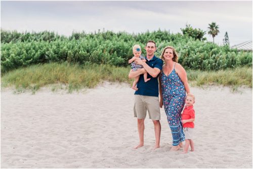 Family playing during Family Beach Portraits in Melbourne Beach, Florida