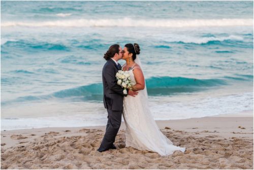 Bride and groom kissing Melbourne Beach elopement