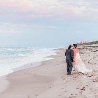 Bride and groom walking on beach Melbourne Beach elopement