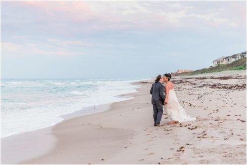 Bride and groom walking on beach Melbourne Beach elopement