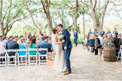 Bride and groom kissing after ceremony Up The Creek Farms Wedding Photography