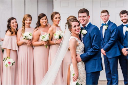 Bridal party by boathouse Up The Creek Farms Wedding Photography