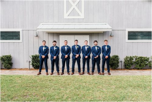 Groomsmen by boathouse Up The Creek Farms Wedding Photography
