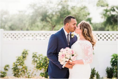 Bride and groom kissing Grand Manor Wedding