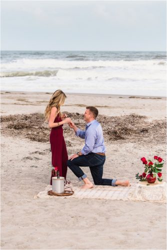 down on one knee in front of the ocean Melbourne Proposal photographer