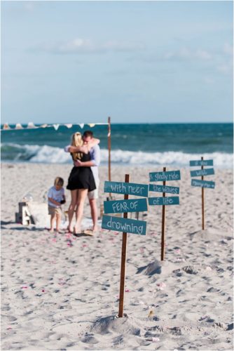 signs on the beach Melbourne Proposal Photographer