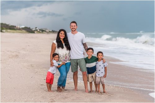 Family on beach with storm coming Melbourne Beach Photographer