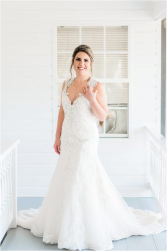 Bride on the porch at the Decklan house at Up the Creek Farms Melbourne Wedding Photographer