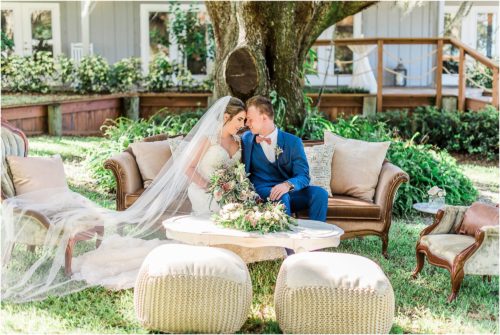 Bride and groom on couch from crystal and crates at Up the Creek Farms Melbourne Wedding Photographer