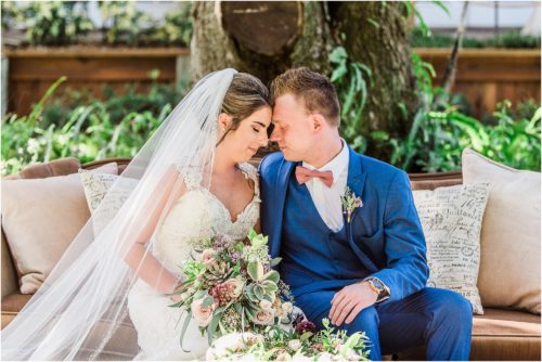 Bride and groom on couch from crystal and crates at Up the Creek Farms Melbourne Wedding Photographer
