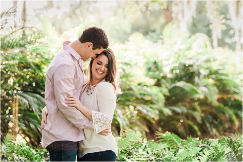 Couple laughing in the ferns during Up the Creek Farms Engagement photography