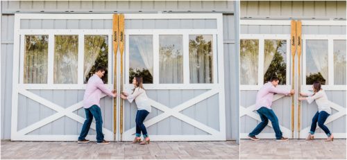 Couple pulling barn doors open during Up the Creek Farms Engagement photography