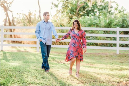 Couple holding hands during Up the Creek Farms Engagement photography