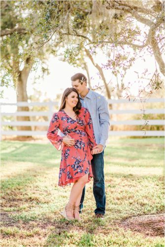 Couple kissing under tree during Up the Creek Farms Engagement photography