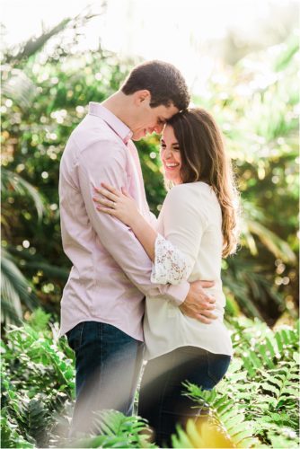 Couple standing in ferns laughing during Up the Creek Farms Engagement photography