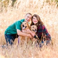 Happy couple in field with glowing grass Melbourne Florida Family Photography