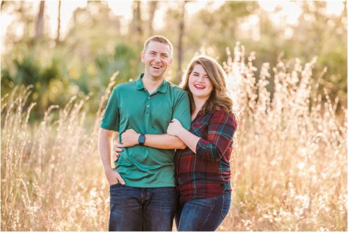 Couple in field with glowing grass Melbourne Florida Family Photography