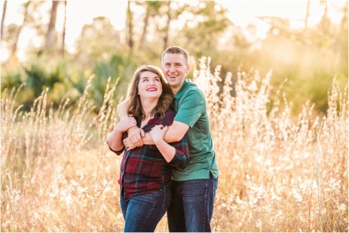 Couple in field for Christmas card photos Melbourne Florida Family Photography