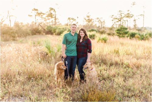 Couple and dogs in a field Melbourne Florida Family Photography