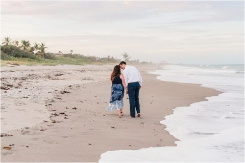 couple kissing on beach engagement photography