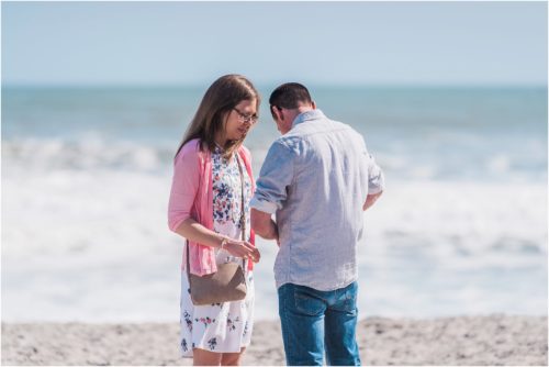 getting ring out of pocket on beach during a Florida Beach Proposal
