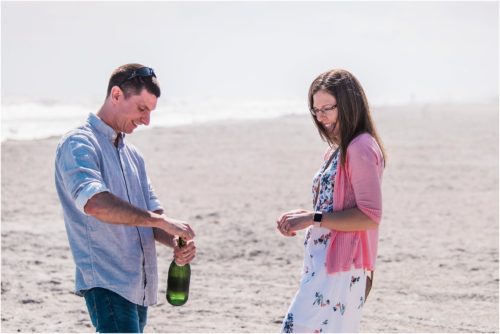 Popping champagne on beach during a Florida Beach Proposal
