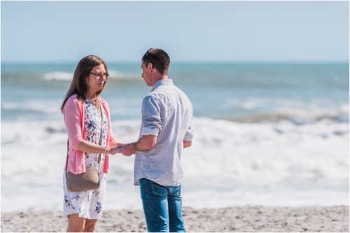 Couple holding hands during a Florida Beach Proposal
