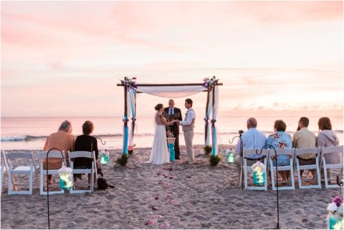 Bride and groom holding hands during Cocoa Beach Sunrise Wedding