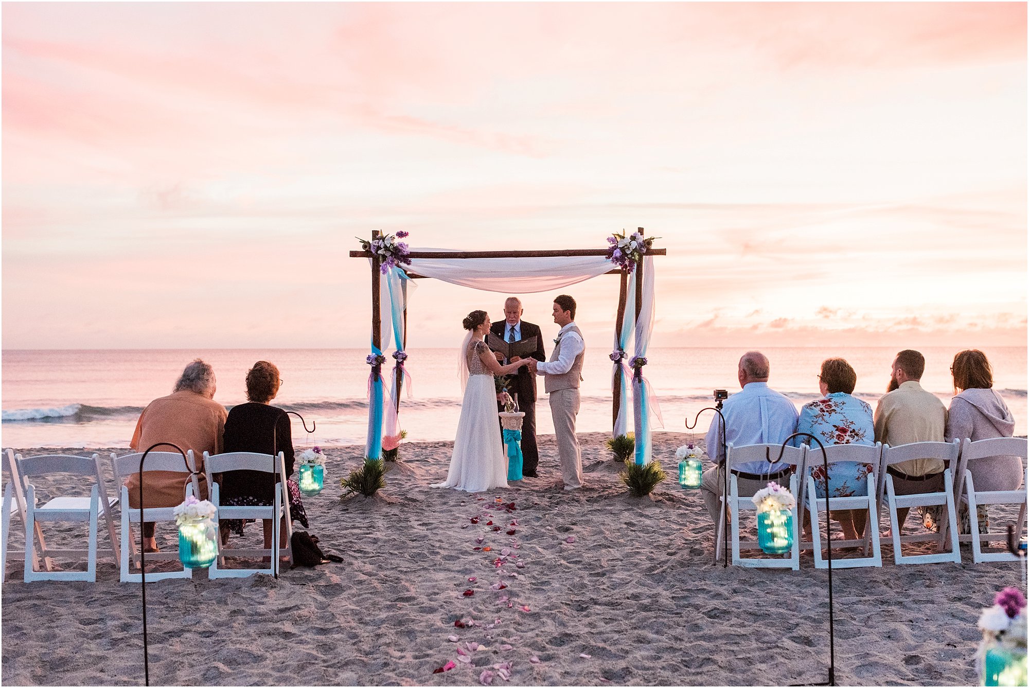 Bride and groom holding hands during Cocoa Beach Sunrise Wedding