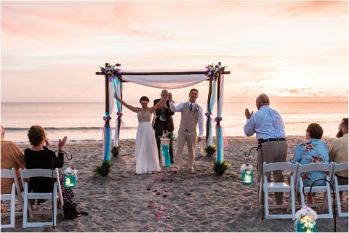 Bride and groom celebrating during Cocoa Beach Sunrise Wedding