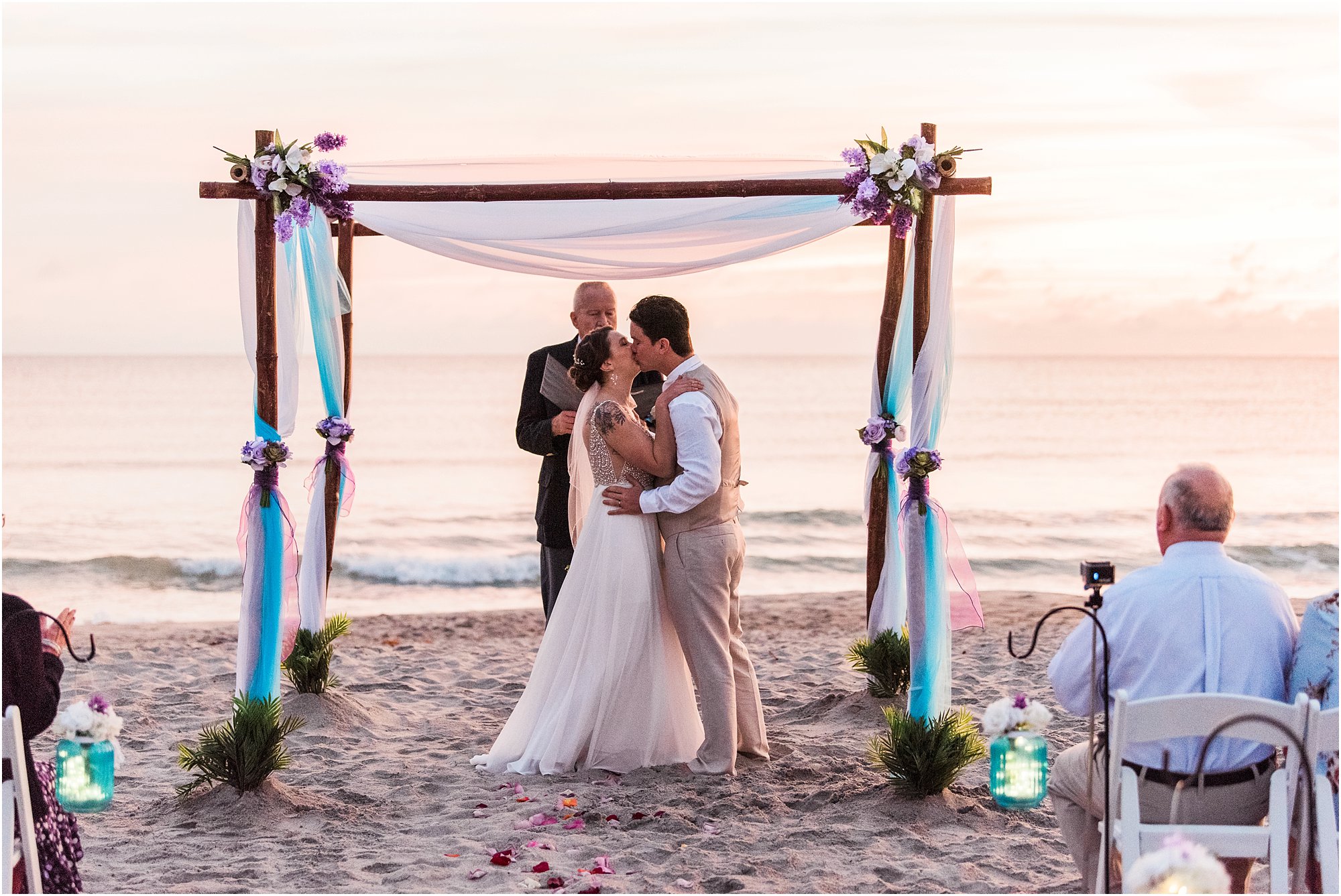Bride and groom first kiss during Cocoa Beach Sunrise Wedding