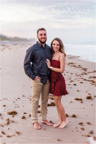 couple on beach during Floridana Beach engagement