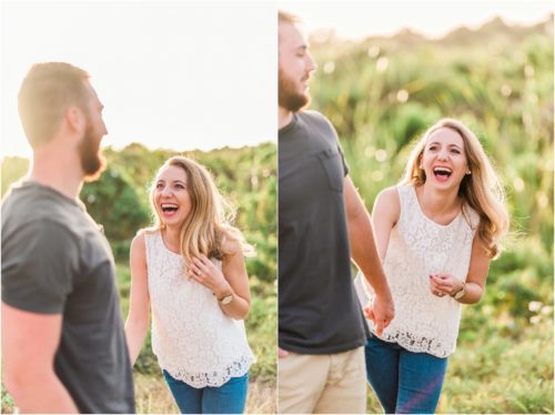 Girl in white shirt laughing in field during Floridana Beach engagement