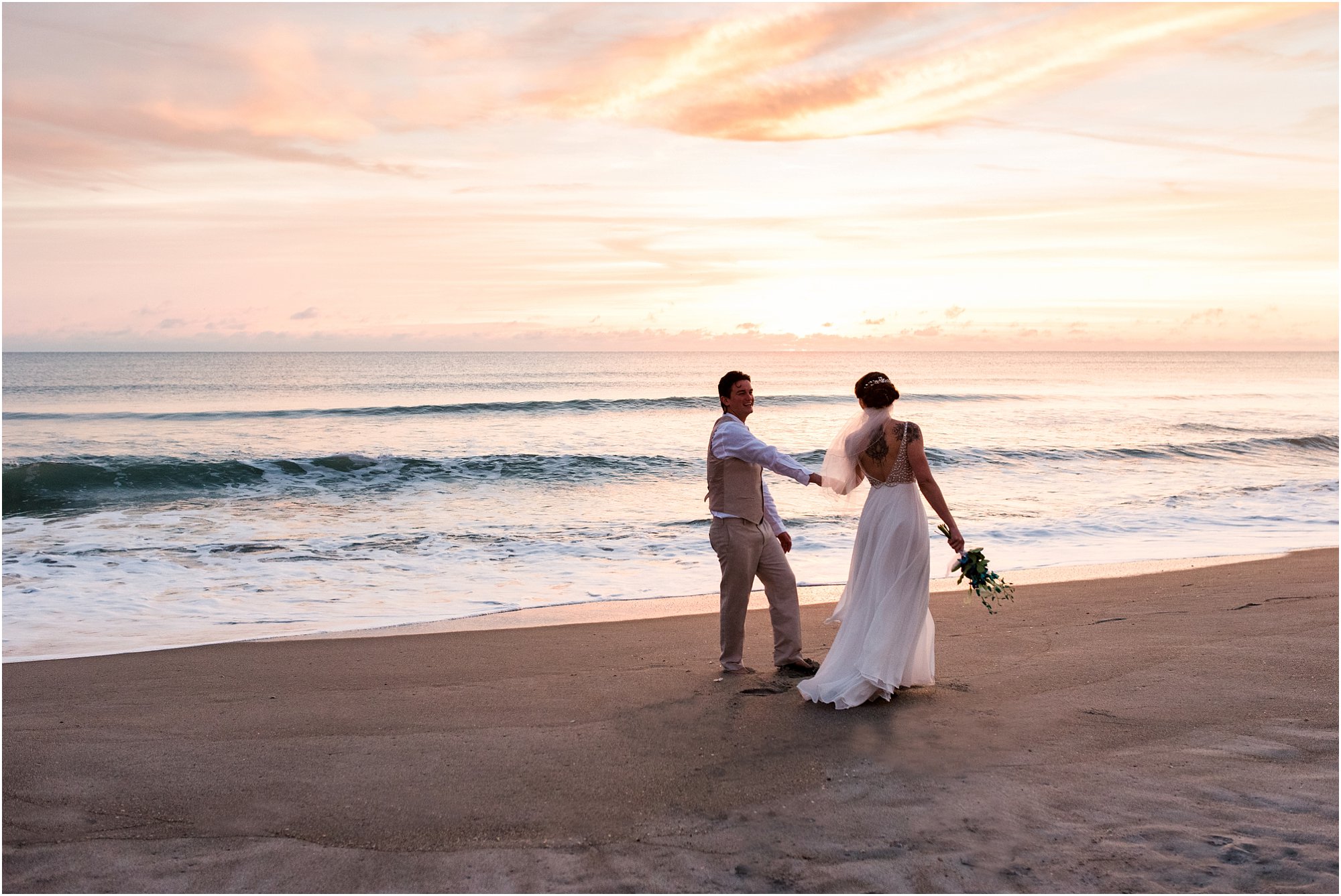 Bride and groom holding hands during Cocoa Beach Sunrise Wedding