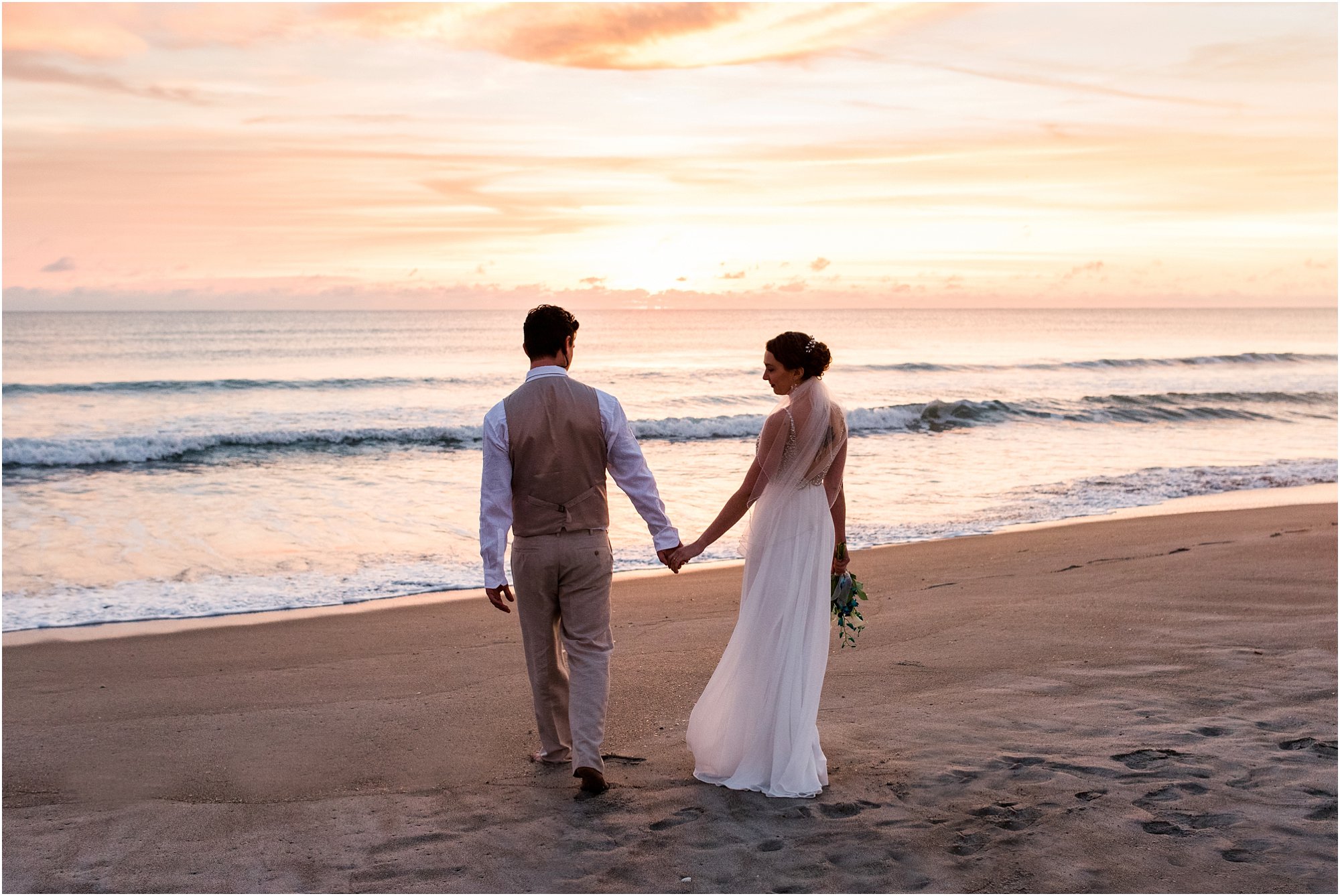 Bride and groom holding hands during Cocoa Beach Sunrise Wedding