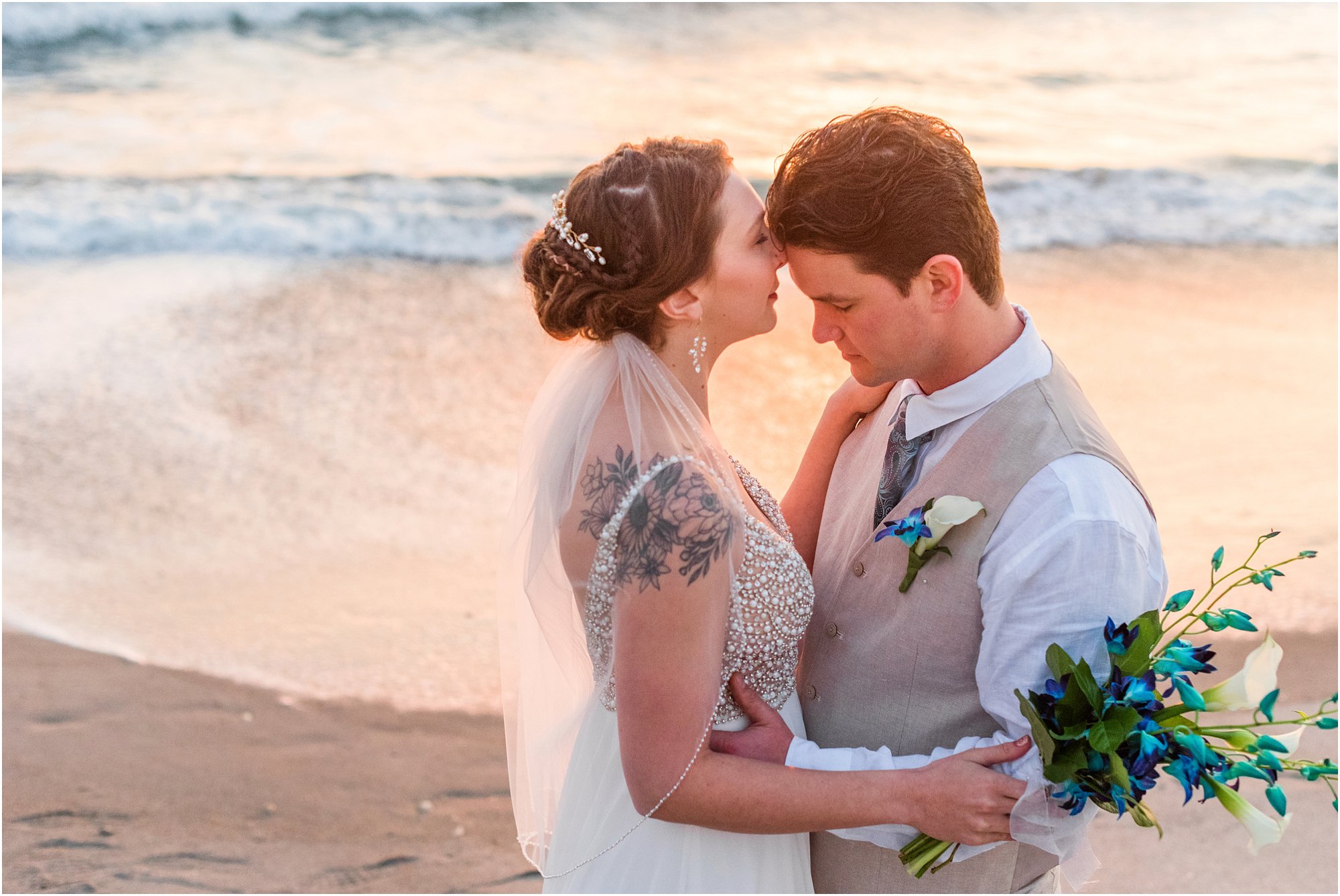 Bride and groom kissing during Cocoa Beach Sunrise Wedding