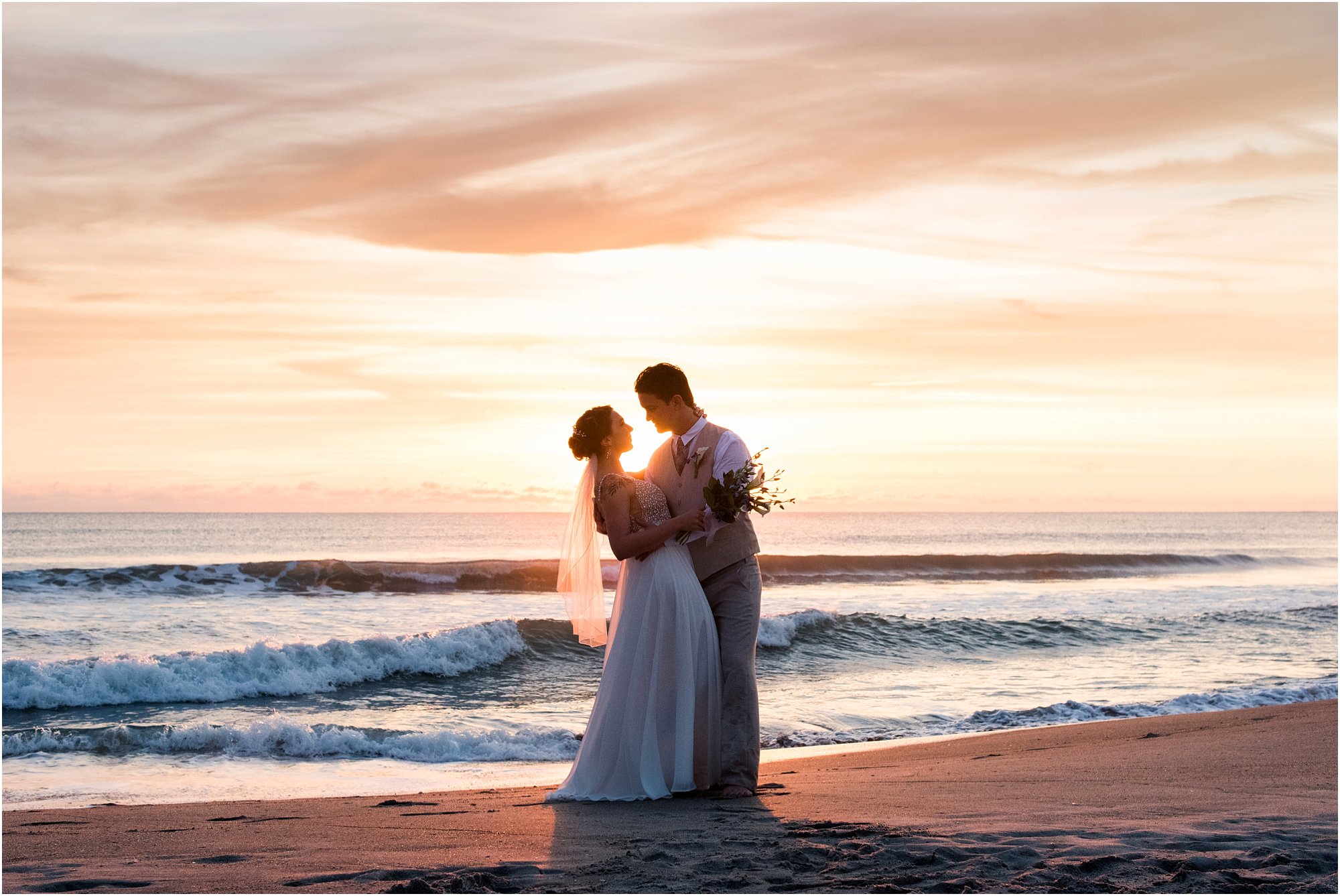 Bride and groom embracing during Cocoa Beach Sunrise Wedding