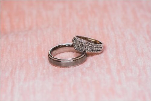Wedding rings on pink background at Banyan Estate Wedding