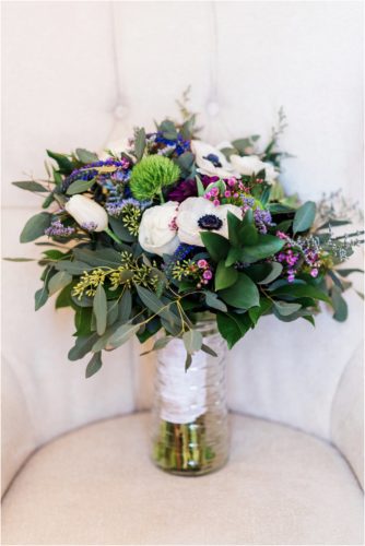 Bride's bouquet with purple flowers by buds etc at Banyan Estate Wedding