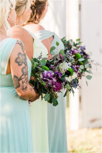Girls holding purple bouquets at Banyan Estate Wedding