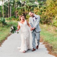 couple walking hand in hand at Banyan Estate Wedding