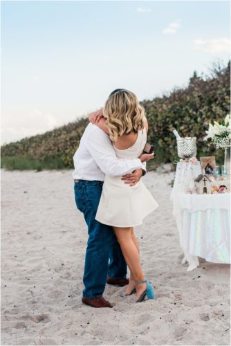 Couple hugging during Satellite beach proposal