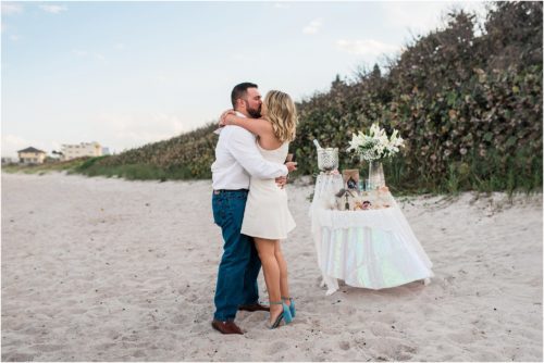 Couple hugging during Satellite beach proposal
