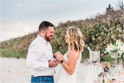 Couple looking at the ring during Satellite beach proposal