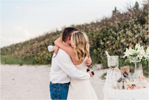 Couple hugging just after proposal during Satellite beach proposal