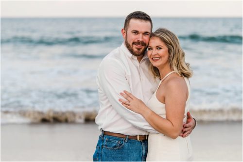 coupe hugging on beach Satellite Beach Surprise Proposal