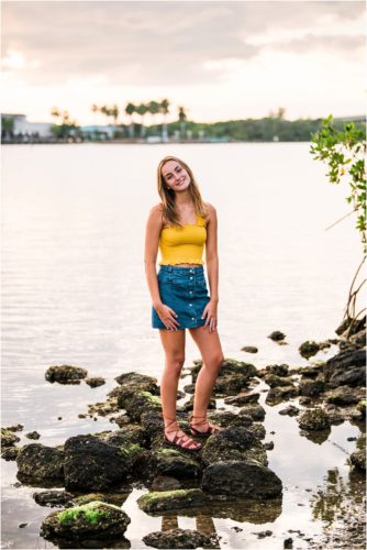 Girl in yellow top by the river Riverside Park Senior Portraits
