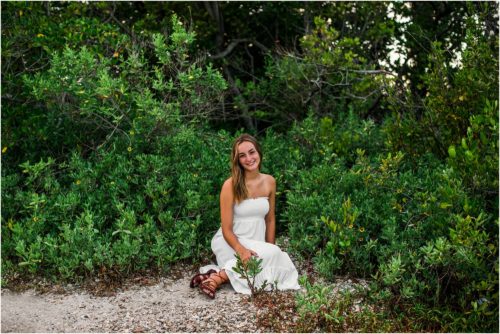 girl in white dress sitting